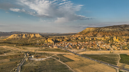 Aerial view of the unique landscape of Cappadocia, featuring the historic village of Cavusin, Turkey