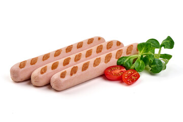 Grilled sausages on a black slate plate isolated on white background.