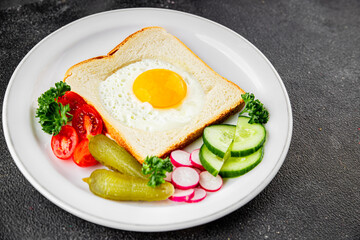 Fried gashouse eggs in bread egg in the basket delicious snack breakfast in a bowl fresh delicious gourmet food background on the table rustic food top view copy space