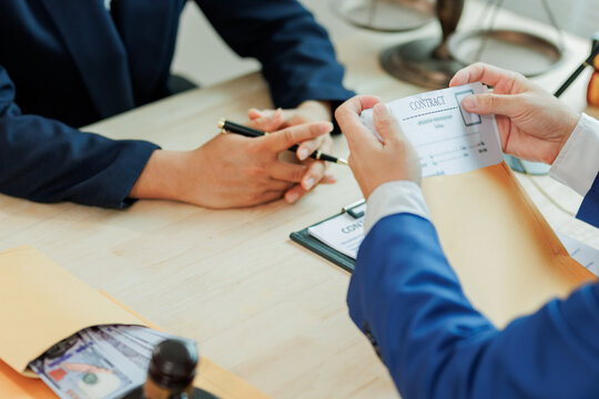 A client submits legal documents to an attorney, providing detailed case information for review and preparation of legal representation.