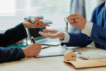 Client pays the agent, who hands over the house keys, marking the official closing and completion...