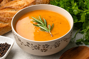 Delicious lentil, ezogelin or pumpkin soup on stone  background