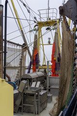 Sorting-cooking plant and sieving machine at fishing trawler in Dutch harbor Zoutkamp in Groningen the Netherlands