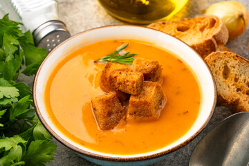 Delicious lentil, ezogelin or pumpkin soup on stone  background