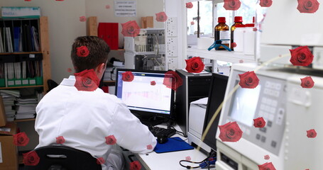 Image of roses over business people using laptop