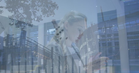 Image of financial data over caucasian businesswoman using smartphone and construction site