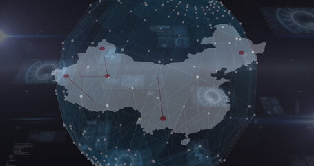 Image of globe rotating over map over screens on black background