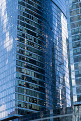 Glass skyscraper on a clear sunny day close-up