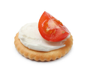 One tasty cracker with cream cheese and tomato isolated on white