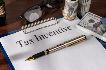 A legal tax incentive file, secured in a clipboard and ready for corporate policy assessment.