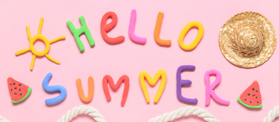 Composition with text HELLO SUMMER made of play dough, mini straw hat and rope on pink background