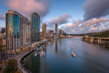 City skyline over a river at sunrise