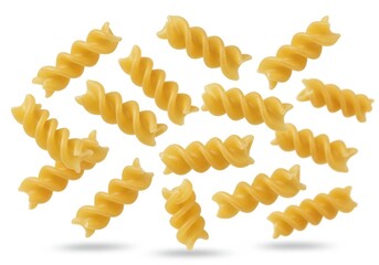Close up of uncooked fusilli pasta spirals scattered on a white background in studio shot