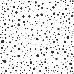 Seamless vector pattern with random scattered black dots of different sizes. Black and white background. Minimal abstract design for textiles, packaging, wallpapers, branding, web and print