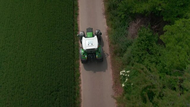 Drone Footage of Tractors Driving and Standing on Farmland &ndash; Aerial View of Agricultural Machinery in Action