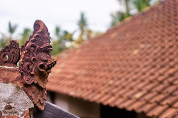 Traditional Decorative Roof Ornament with Rustic Tile Background..