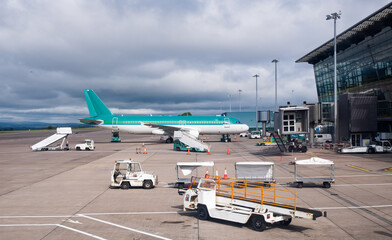 Airplane on the departure runway in a modern airport. Aviation industry