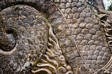 Close-Up of Intricate Stone Carving Depicting Decorative Patterns and Textures..
