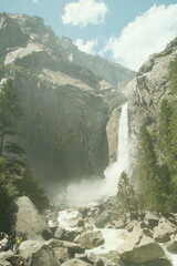 Yosemite National Park in California’s Sierra Nevada mountains aesthetic greenery landscape scenery on sunny day granite cliffs waterfall