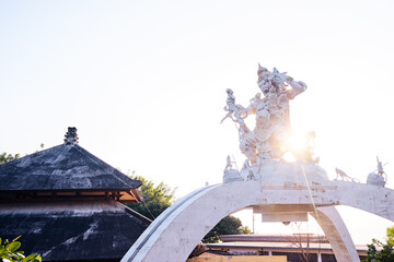 Traditional Hindu Statue with Roof in Sunlit Morning Scene..
