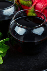 A glass of dragon fruit juice.