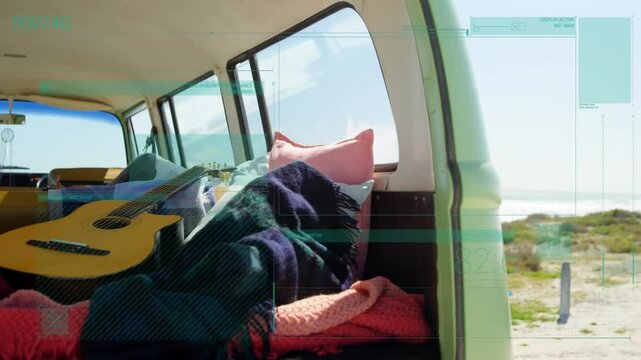 Camper van interior being animated in flat design, showing piled blankets topped by acoustic guitar