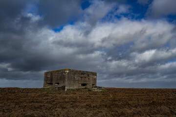 Bunker of world war one preserved in agricultural field. Remnant of the past, conflict of 20th...
