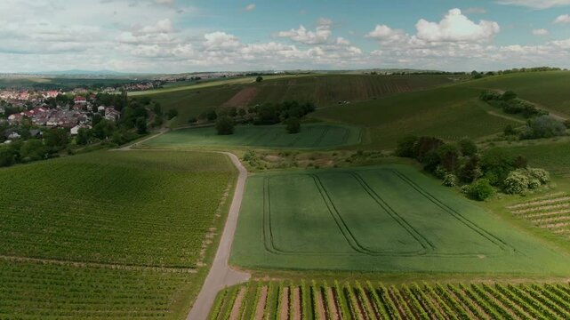 Drone Footage of Tractors Driving and Standing on Farmland &ndash; Aerial View of Agricultural Machinery in Action