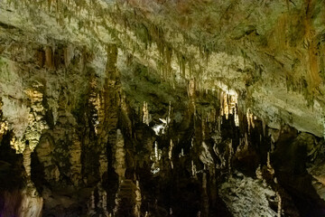 Exploring beautiful Postojna cave in Slovenia the most visited european cave.  Thousands of stalagmites and stalactites