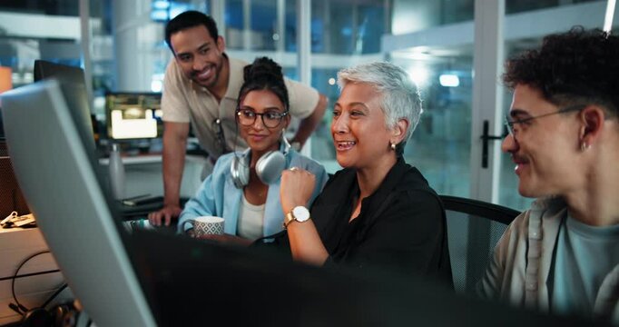 Collaboration, computer and smile of people at desk in office as programmers for evening software development. Coding, teamwork and web design with developer group in workplace for night shift