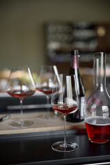 Decanter for sparkling wine on the table, Champagne tasting, Wine glasses and bottle, reflections, rose wine