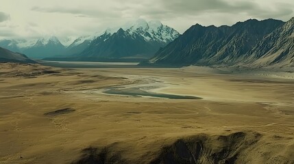 Fototapeta premium Majestic Mountain Range and Arid Valley Landscape