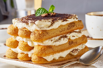 Indulge in a Delicious Tiramisu Dessert Stack, lovingly made with Cream and Cocoa Powder