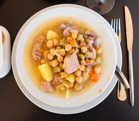 Popular dish of Spanish cuisine is Cocido de garbanzos, made from meat, vegetables and chickpeas