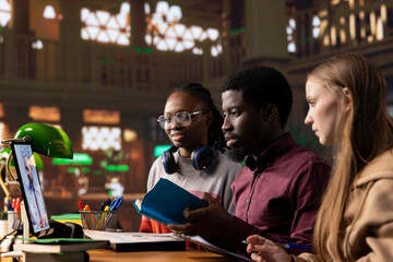 Diverse students group engaging in a video call with a physician, learning about medical topics and methods. Medicine pupils utilizing telemedicine tools for remote learning in a university library.