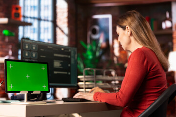 Focused person engaging with AI assistant on pc next to chroma key, using the chatbot for automation and data driven algorithms to provide instant solutions. Connectivity and online tasks.