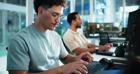 Computer, reading and typing with man at desk in office as programmer for software development. Coworking, data and web design with confident developer or system engineer in workplace for update - Powered by Adobe