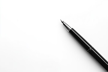 Black pen on white paper.  A black pen angled on a white surface.  The pen's tip and barrel are clearly visible