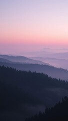 Misty mountain range at dusk with layered hills and soft hues