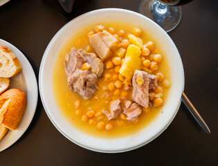 Popular dish of Spanish cuisine is Cocido de garbanzos, made from meat, vegetables and chickpeas