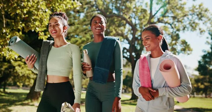 Fitness, friends and walking with yoga mat at park for wellness exercise, workout tips or ready for class. Yogi, women or pilates equipment in nature for health routine, conversation or start morning