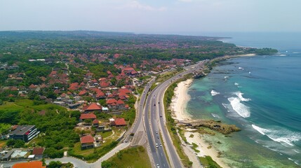 Fototapeta premium High-angle view of coastal highway and residential area.