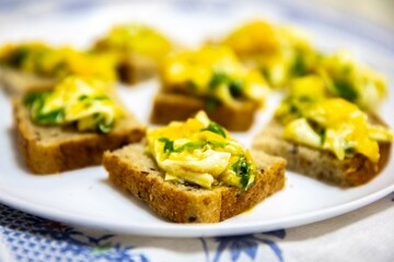 Scrambled eggs with parsley served on sourdough artisan bread