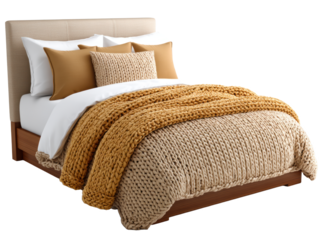 Cozy double bed with knitted beige and brown blanket and matching pillows creating warm and inviting atmosphere