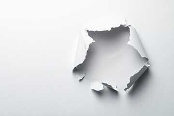 Torn white paper, irregular hole