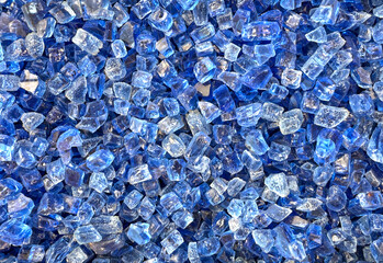 Blue glass bits in a fire pit
