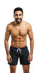 Fototapeta premium A cheerful young adult South Asian man with a muscular physique and beard, smiling happily while wearing black swim trunks, isolated on a transparent background.