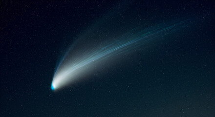 Fototapeta premium Blue comet streaks through starry sky