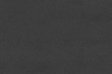 Seamless textured black Polartec Power Dry fabric background with a subtle grainy appearance, ideal for use in design projects, presentations, or as a backdrop for various creative applications.