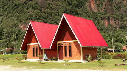 On a sunny day, two modern minimalist style a frame villas adorn the green landscape of Harau Valley. Built for travelers and nature lovers who want comfort amidst the beauty of nature.